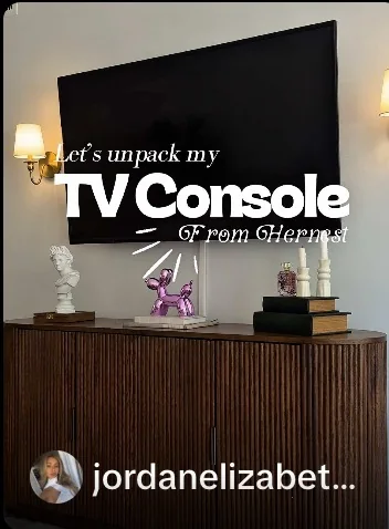 HERNEST media console styled below a television in a creator video still.